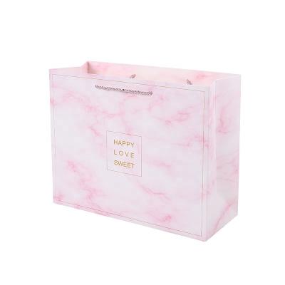 China Wholesale Luxury Custom Printing Pink Shopping Packaging Small Paper Gift Bag With Your Own Logo for sale