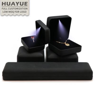 China Ring Bracelet Necklace Earring Jewelry Private Label Black Lighted LED PU Leather Men's Flip Bracelet Necklace Ring Business Packaging Jewelry Boxes with LED Insert velvet for sale