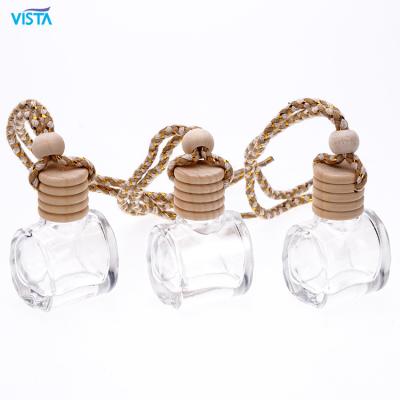 China Small VUE 10ml 15ml 20ml Air Freshener Glass Bottle Car Cosmetic Hanging Perfume Bottle With Wooden Screw Top for sale