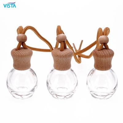 China VUE 2022 New Design Car Perfume Cosmetics Packaging Empty Cosmetic Round Glass Bottle With Wooden Lids for sale