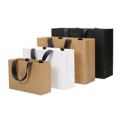 China Yuteng Handmade Wholesale Hot Foiled Kraft Paper Bag Custom Foiled Stamping Custom Packaging Cardboard With Handle For Clothing/Gift/Food/Packagin for sale