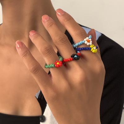 China High Quality Simple Cute Colorful Boho Jayseed Happy Pearl Daisy Flower Elastic Adjustable Rope Ring For Women Ladies for sale