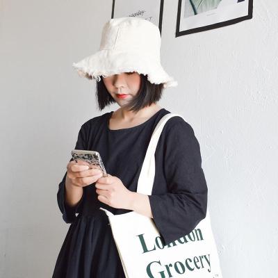 China Fashion Casual Solid Color Cotton Bucket Hats Foldable Distressed Washed White Fringed Brim Bucket Hat for sale