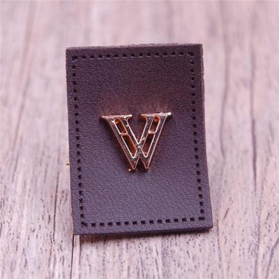 China Viable Wholesale High Quality Embossed Jeans Leather Patch Label Custom Jeans Leather Patch With Metal Logo for sale