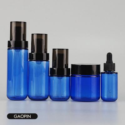 China Transparent Blue Plastic Luxury Cosmetic Spray Bottle 25ml 30ml 50ml 80ml 100ml PET Skin Care Set Bottle for sale