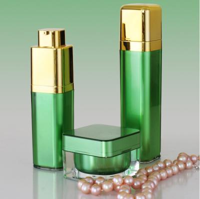 China Golden Pump Acrylic Lotion Bottles Jars, Green Square Acrylic Cosmetic Package Bottle Jars for sale