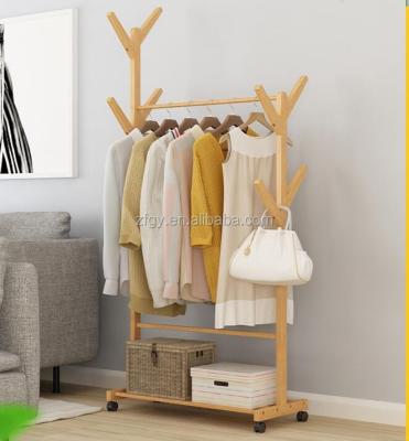 China Eco - Friendly Clothing Store Freestanding Wooden Display Rack With Wheels for sale