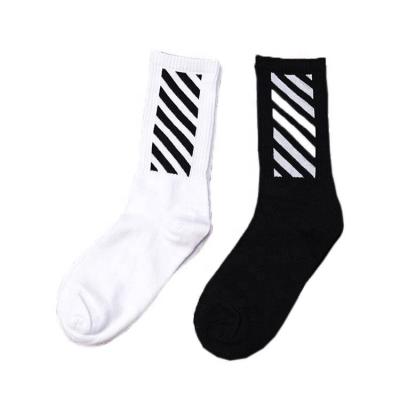 China QUICK DRY custom knit design logo crew socks manufacturer socks, soft custom logo sport sock, unisex black stripe design teen tube socks for sale