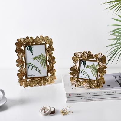 China Environmental Friendly Creative Metal Beautiful Photo Frame Ornament Display Props Desktop Decoration for sale