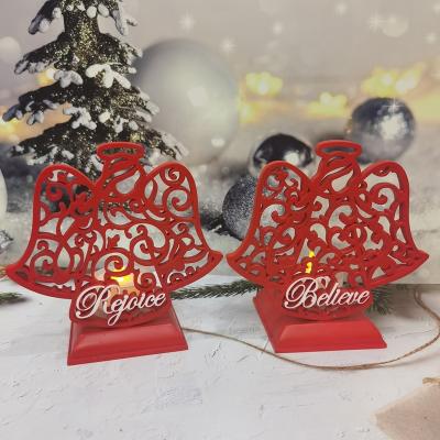 China Europe Christmas Decorations Red Resin Angel LED Candles Resin Hollow Electronic Tealight Candle Holder for sale