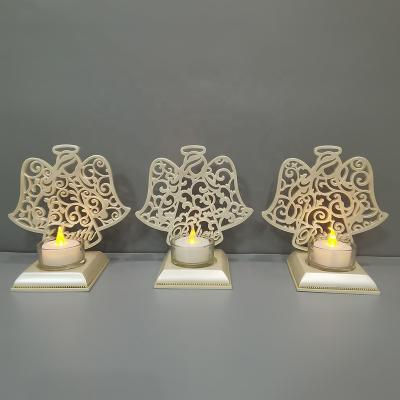 China Europe Christmas Decorations Bead Hollow Resin Angel LED Candles Resin Electronic Tealight Candle Holder for sale