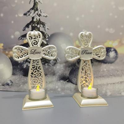 China Europe Christmas Decorations Bead Hollow Electronic Resin Cross LED Candles Resin Tealight Candle Holder for sale