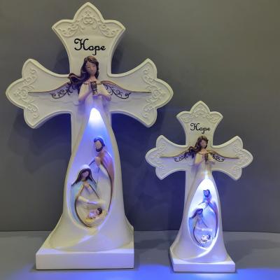 China Religious Lighted Angel Nativity Cross Scene Polyresin LOVE/PEACE/FAITH/HOPE Resin Angel Cross Light Europe Home Decorations for sale