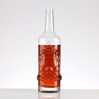 China Customizable Exclusive Liquor Design Crown Lion Carved Glass Bottle 750ml Whiskey Glass Bottle for sale