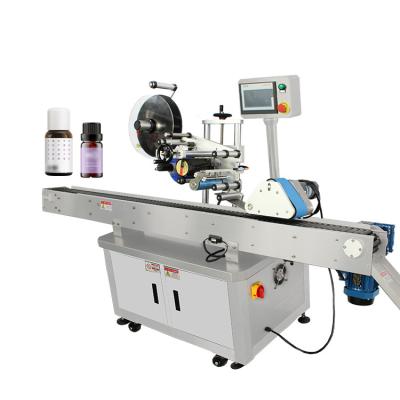 China Automatic Horizontal Round Bottle Labeling Machine Top Label Applicator Machine Product Labels For Cosmetic Bottle for sale