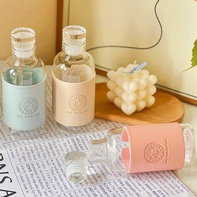 China Stocked Hot selling round portable glass water bottle clear cylinder juice glass bottles for sale