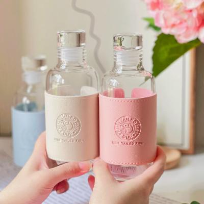 China Stocked 330ml glass water bottle wine glass bottle leak proof lid portable borosilicate glass cup for sale