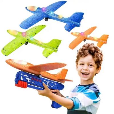 China Children outdoor game toy Hot Selling 3 Pack Flying Airplane Launcher Toy Gun LED Foam Glider Catapult Plane Toy For Kids Outdoor Sport Flying Toys for sale