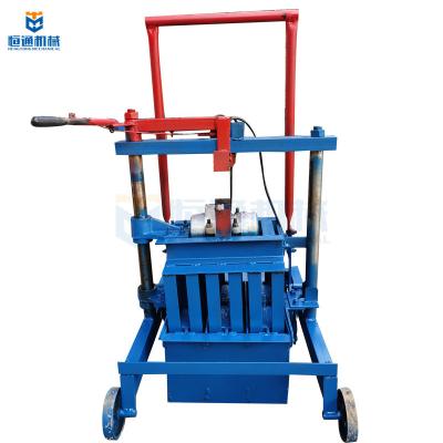 China High Efficiency Manual Block Making Machine Hollow Adobe Hydraulic Pressure for sale