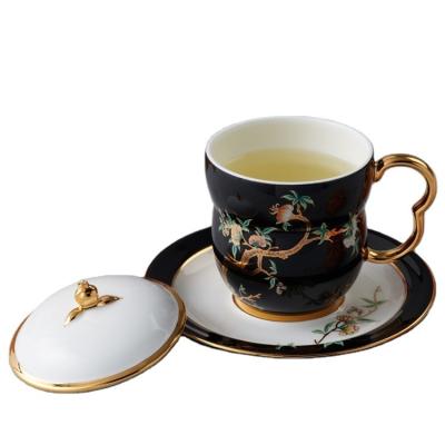 China Auratic Sustainable Design New Planted Elegant Gold Glaze Black And White Fine Porcelain Cup And Saucer Set for sale