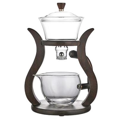 China Viable antique pyrex glass teapot set with wooden stand automatic glass tea maker for sale