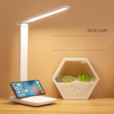 Китай Eye Care OEM ODM LED Desk Lamp USB Charging Eye Protection Led Reading Lamp With Phone Holder продается