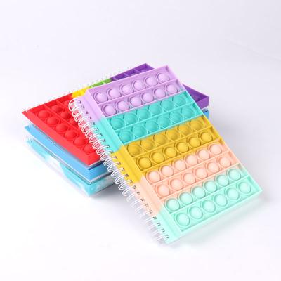 China Amazon Popular Silicone Spiral A5 Color Lined Notebook Spiral Silicone Notebook for sale