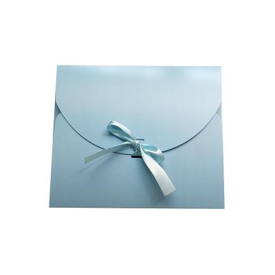 China Modern Luxury Custom Gift Small Packaging Blue Cardboard Paper Envelope With Ribbon for sale