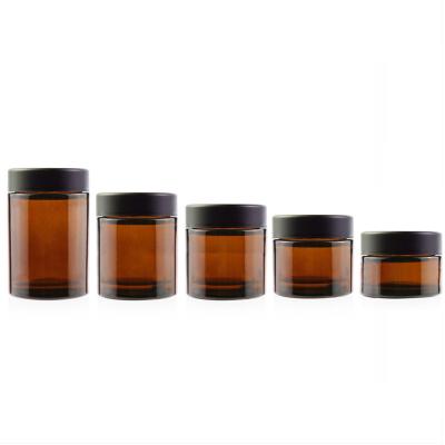 China 2oz Amber Child Packaging Resistant Glass Jar With Child Proof Lid For Flower Packaging for sale