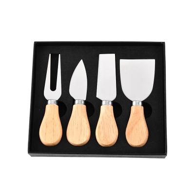 China Hot Sustainable Amazon Selling 4 Pieces Set Wooden Handle Stainless Steel Cheese Butter Pizza Knife Set Slicer for sale