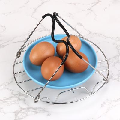 China Sustainable High Quality Round Kitchen Egg Rack 304 Stainless Steel Rack Teaming With Rubber Handle for sale