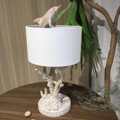 China Modern Wholesale High Quality Modern Dolphin Animals Bedside Resin Table Lamp For Bedroom Living Room Restaurant for sale