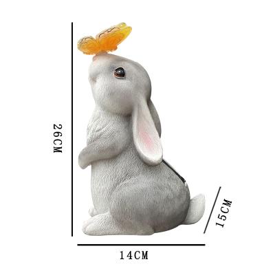 China Wholesale Custom Outdoor Cute Life Size Rabbit Dog Garden Decor Europe Resin Animal Statue With Solar Light Butterfly for sale