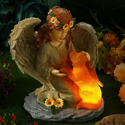 China Wholesale Custom Outdoor Garden Decor Cute Europe Small Resin Angel Statue With Solar Light Dog for sale