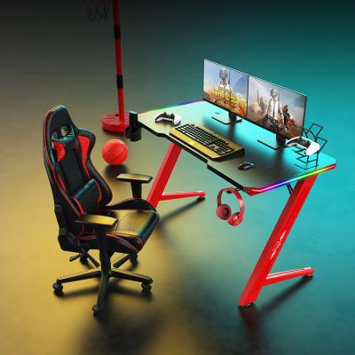 China Ergonomic extendable gaming desk RGB esports gaming table PC gamer desk for sale