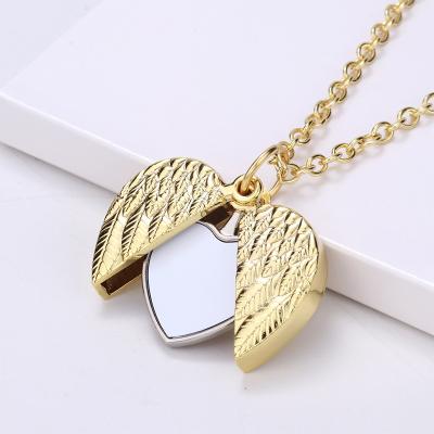 China Double Sides Rotating Custom Heart Wing Custom Necklace Jewelry Pendant Photo Print Metal Pendant Sublimation Women for sale