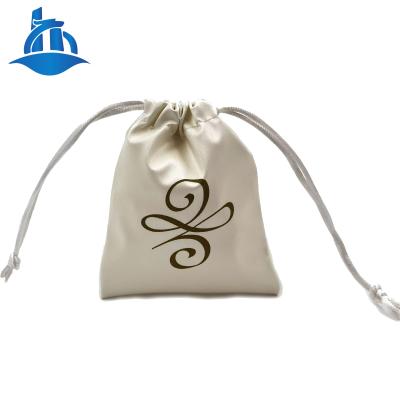 China Eco-Friendly Embossed Use PU Leather Drawstring Jewelry Pouch Bag With Pull String for sale