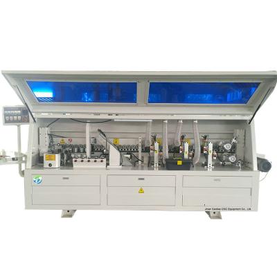 China Full Automatic Sideboard PVC Edging Machine For Furniture Wood Processing for sale