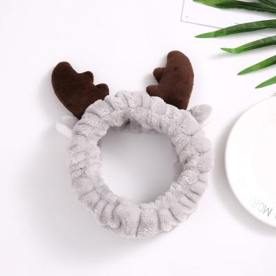 China Custom Fanyue Reindeer Vintage Reindeer Headband Flannel Bow Bow Face Wash Headband Cute Winter Cute Ear Warmer for sale