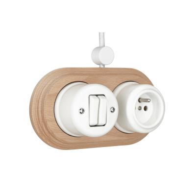 China Easy Installation White Color Vintage 2 Strip Wall Button Ceramic Switch And German Socket With A Wooden Frame for sale