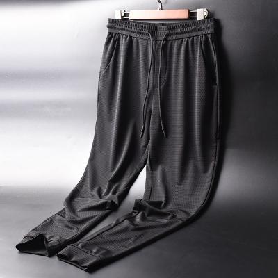 China Men's Slim Ice Silk Summer Anti-wrinkle All-match Sports Loose Pants Men's Quick-Drying Nine-Point Pants for sale