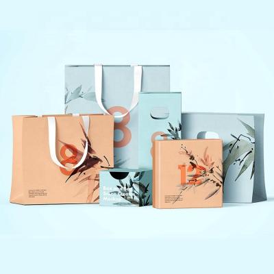 China Recycled Materials Logo Print Custom Shopping Paper Bag With Handles Clothing Shoe Packaging Gift Cheap Washable Paper Bag for sale