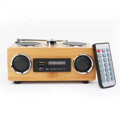 China Mini Hot Selling Ibastek Portable BT FM Radio Wireless Speaker Bamboo Wooden Wireless Speaker for sale