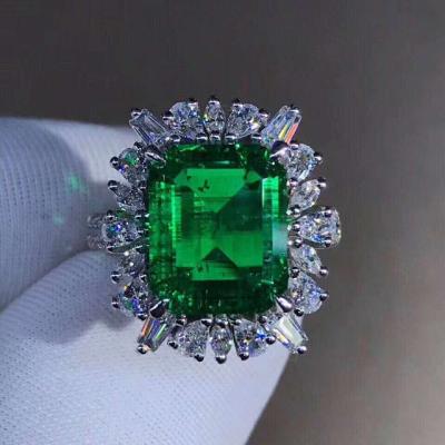 China Gold Custom Design Wedding Ring 18k Solid White Gold Moissanite And Emerald Ring for sale