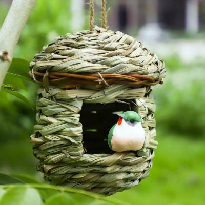 China New Breathable Simple Handmade Straw Bird Nest Comfortable Outdoor Pet Bird House Supplies for sale