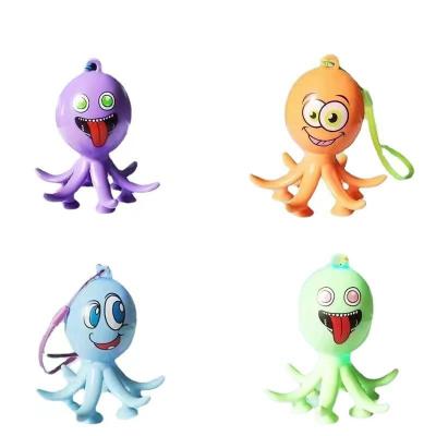 China Popular Octopus Jump Tubes With Light Plastic Sensory Funny Expression Tubes Toys Key Chain With Sucker Cup Strong Relaxation Toy for sale