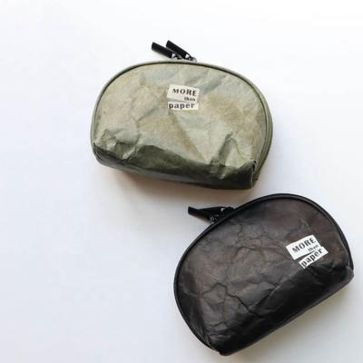 China Dupont Round Portable Waterproof Paper Bag Wash Storage Travel Lady Gray Shell Cosmetic Bag Half for sale