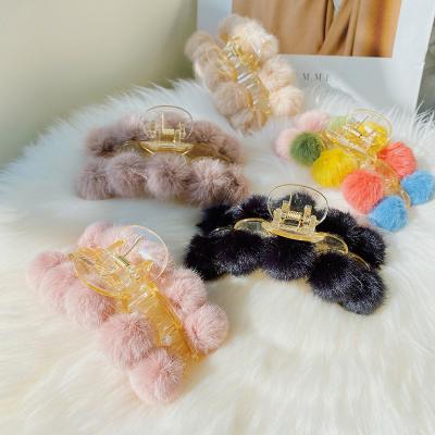 China Fashion and simplicity 2021 new design autumn and winter South Korea hot hair clips for girls large plush fur ball hair claw acrylic women for sale