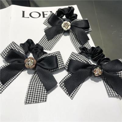 China New Style Alloy Camellia Bow Flower Hair Tie Gum Elastic Headband Pure White Black Korean Style Handmade Scrunchies for sale