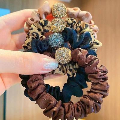 China High Quality Leopard Korean Elastic Scrunchies Crystal Rhinestone Hair Tie Ball Elastic Hair Ties Women Style Hair Ties Rope Accessories for sale